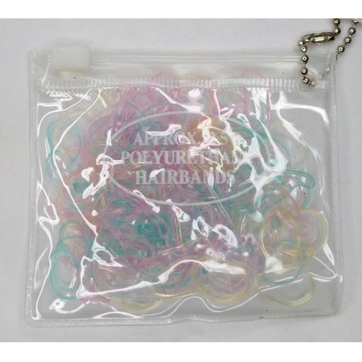 Transparent purse containing 250 small polyurethane bands. Pastel colour